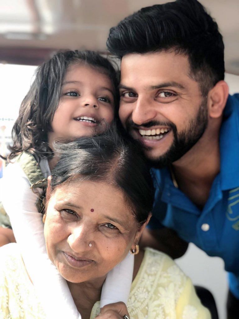 Suresh Raina and his daughter with his mother