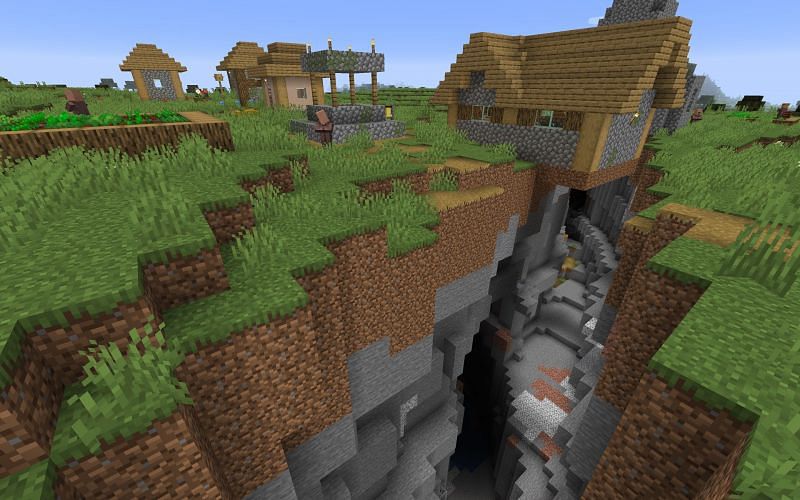 Village split by ravine (Image via Minecraft)