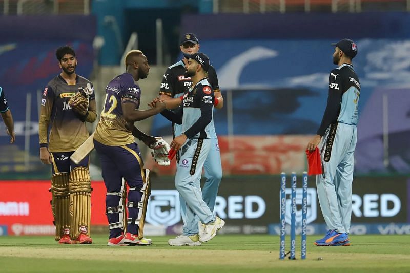 Andre Russell and Virat Kohli shake hands after the end of match 31 of IPL 2021. Pic: IPLT20.COM