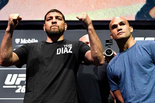 Nick Diaz and Robbie Lawler during a ceremonial face-off ahead of UFC 266.