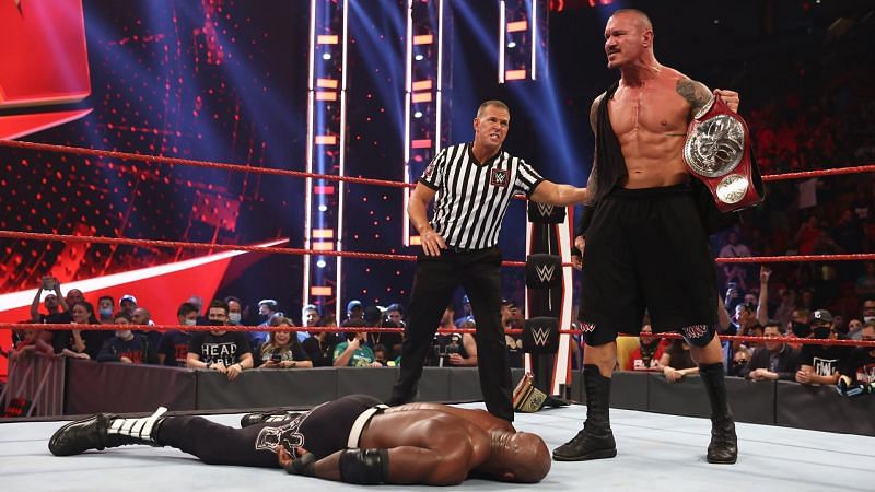 Randy Orton holding up the Universal Championship above Bobby Lashley on RAW