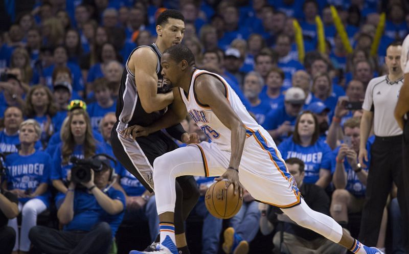 Kevin Durant looks to drive against Danny Green.