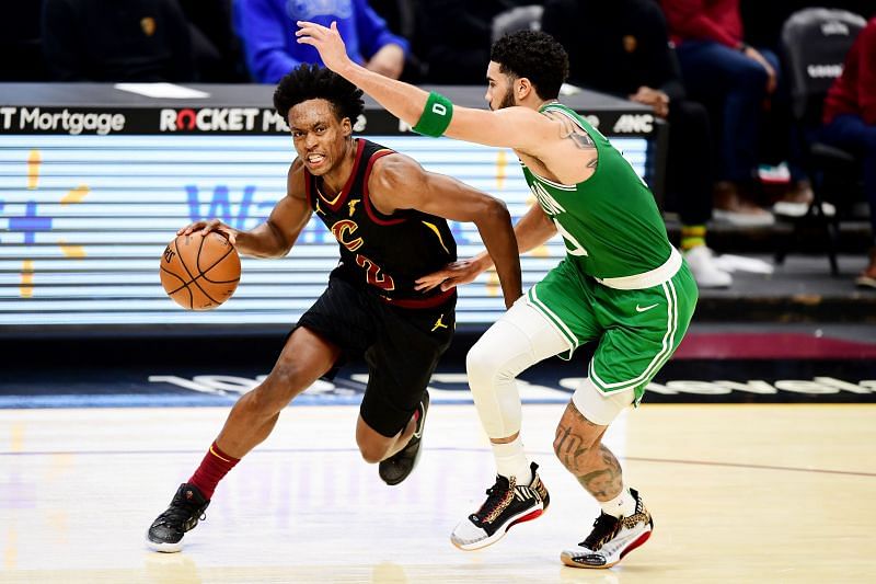 Collin Sexton (#2) of the Cleveland Cavaliers drives against Jayson Tatum (#0).