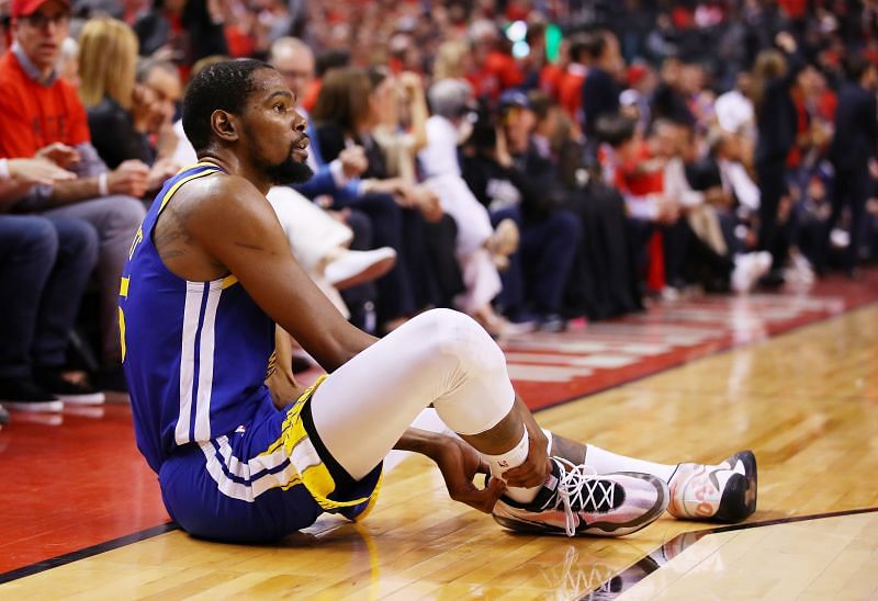 Kevin Durant on the floor after rupturing his right Achilles tendon in Game 5 of the2019 NBA Finals.
