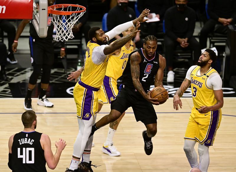 LA Clippers' Kawhi Leonard battling with LA Lakers' Andre Drummond