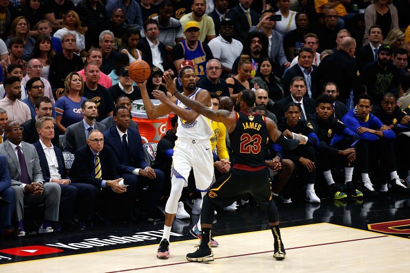LeBron James guards Kevin Durant during an NBA game.