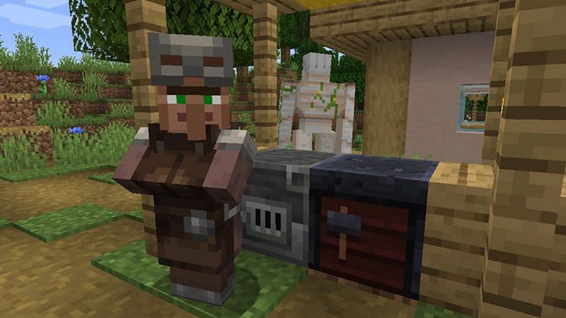 An armorer villager stands near their blast furnace (Image via Minecraft)