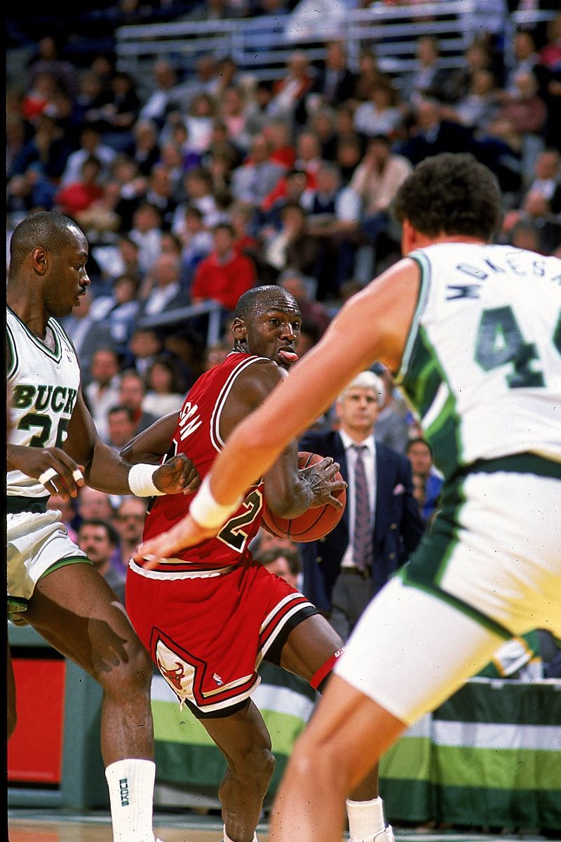 Michael Jordan (#23) of the Chicago Bulls moves with the ball during a game against the Milwaukee Bucks.