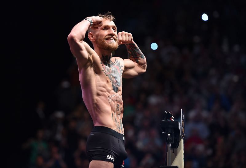 Conor McGregor weighs in at the featherweight limit of 145 against Jose Aldo before UFC 194