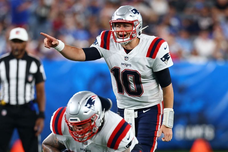 New England Patriots quarterback Mac Jones controlling the line of scrmmage