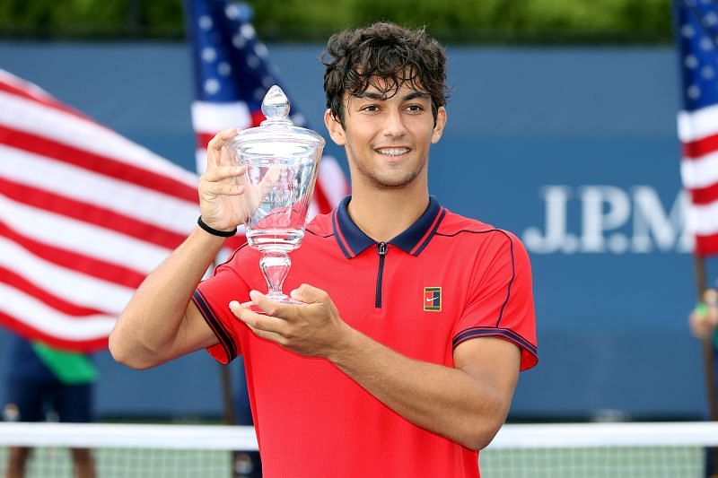 Daniel Rincon with the 2021 US Open boys singles trophy