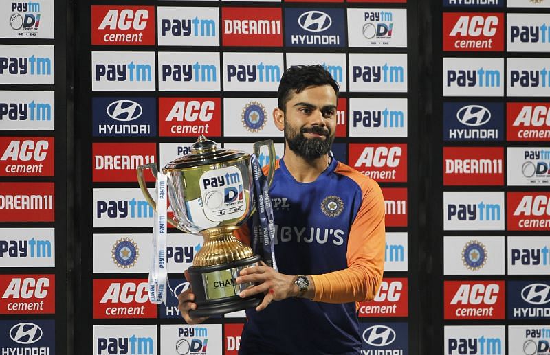 Virat Kohli poses with the trophy after India's series win over England.