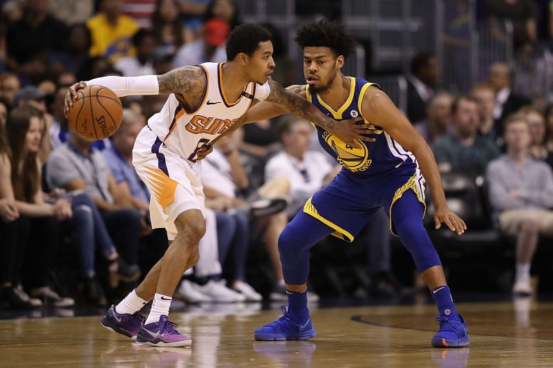 Quinn Cook (right) in action during an NBA game while playing for the Golden State Warriors