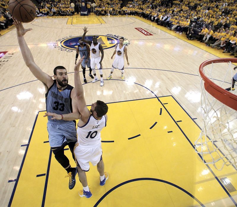 Marc Gasol #33 of the Memphis Grizzlies shoots over David Lee #10 of the Golden State Warriors during Game Five of the Western Conference Semifinals of the NBA Playoffs at ORACLE Arena on May 13, 2015 in Oakland, California.