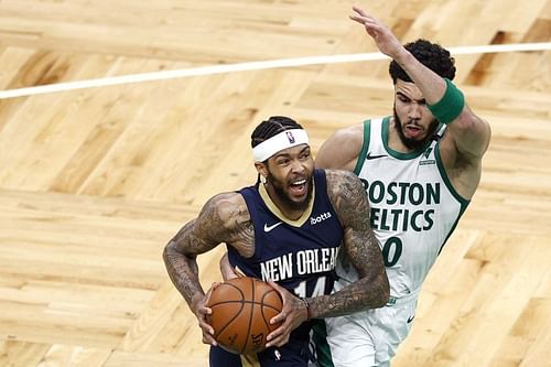 Brandon Ingram (#14) of the New Orleans Pelicans drives to the basket against Jayson Tatum (#0) of the Boston Celtics