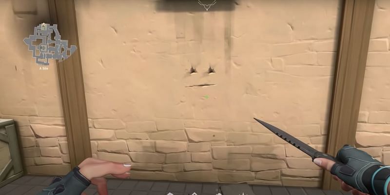 Making a face by knifing the wall (Image via youTube/Mr.LowLander)