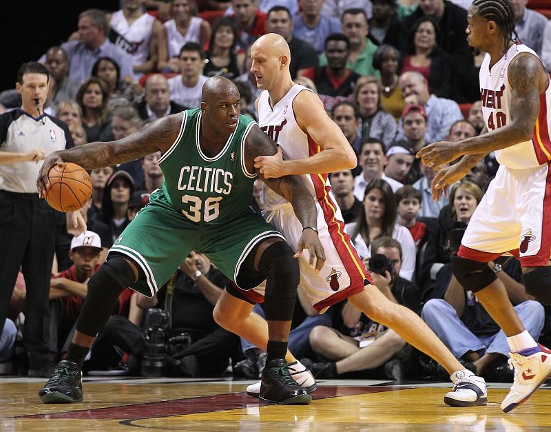 Shaquille O&#039;Neal #36 of the Boston Celtics is guarded by Zydrunas Ilgauskas
