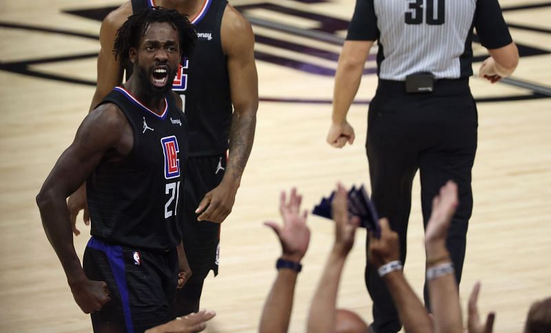 Patrick Beverley reacts after making a successful playing during an NBA game.