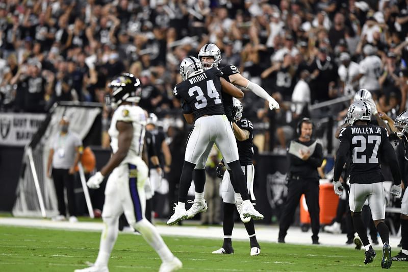 Carl Nassib celebrates a tackle with K.J. Wright in the Las Vegas Raiders v Baltimore Ravens game