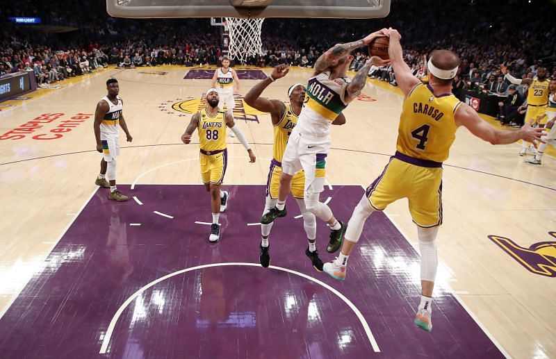 New Chicago Bulls Alex Caruso and Lonzo Ball meet at the rim