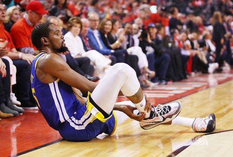 Kevin Durant #35 of the Golden State Warriors reacts after sustaining an injury during the second quarter against the Toronto Raptors during Game Five of the 2019 NBA Finals at Scotiabank Arena on June 10, 2019 in Toronto, Canada