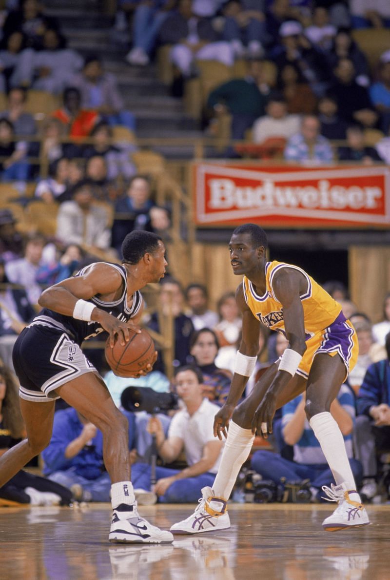 Michael Cooper #21 of the LALakers plays defense during an NBA game against the San Antonio Spurs,