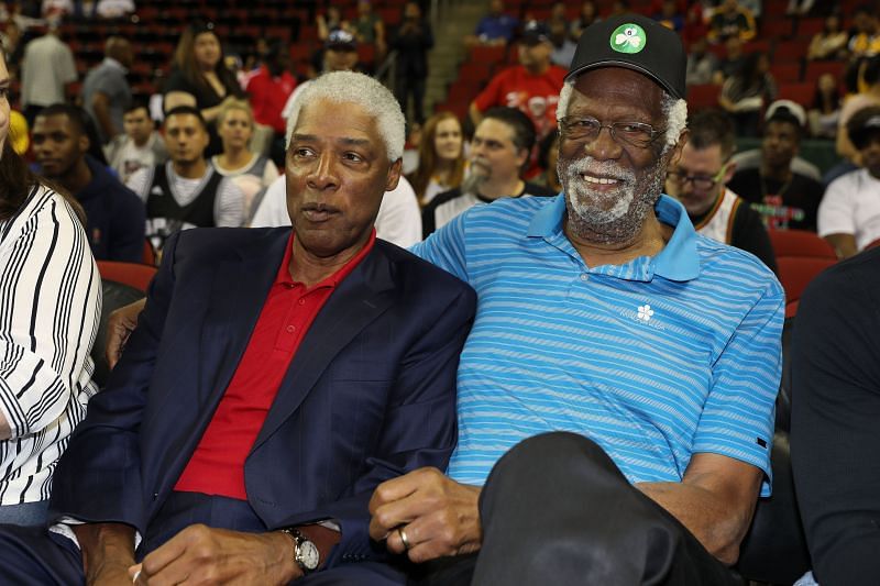 Bill Russell (right) sitting next to Julius Erving