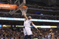 Vince Carter dunks the ball during an NBA game.