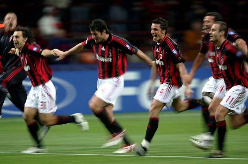 AC Milan players celebrate their 3-0 win over Manchester United.