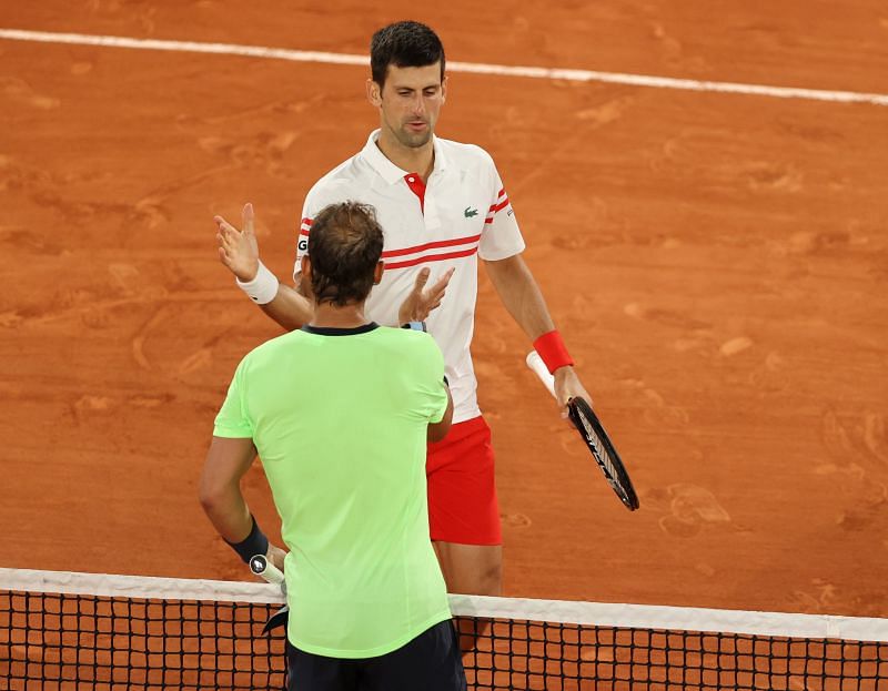 Novak Djokovic shakes hands with Rafael Nadal after their 2021 Roland Garros encounter