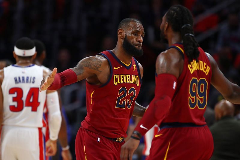 LeBron James #23 of the Cleveland Cavaliers celebrates a first half three point basket with Jae Crowder #99 while playing the Detroit Pistons at Little Caesars Arena on November 20, 2017 in Detroit, Michigan. Cleveland won the game 116-88.