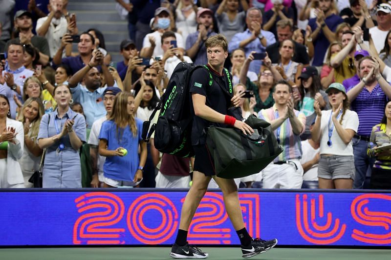 Jenson Brooksby walks off the court after his match