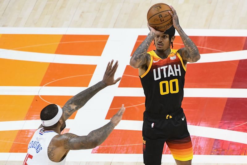 Jordan Clarkson #00 of the Utah Jazz shoots over DeMarcus Cousins #15 of the LA Clippers in Game Two of the Western Conference second-round playoff series at Vivint Smart Home Arena on June 10, 2021 in Salt Lake City, Utah.