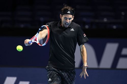 Dominic Thiem striking a backhand.