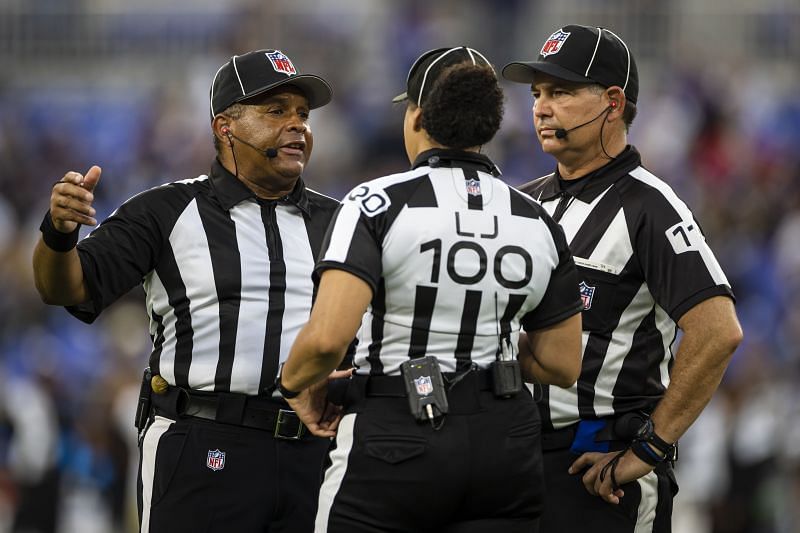 NFL Referees during a match discussing a call