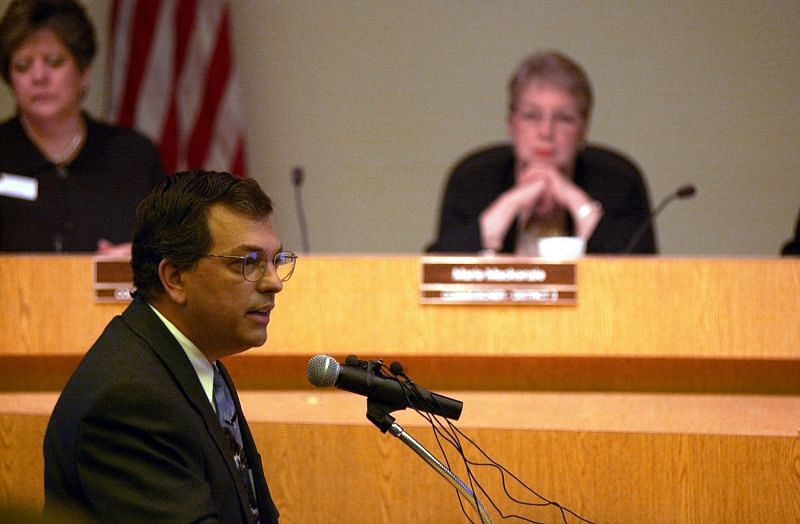 Bob Enyart looks over at the residents of Huntington Estates as he testifies at the Arapahoe County Commisioner&#039;s hearing. (Image via Getty Images)