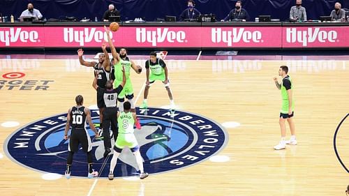 The Minnesota Timberwolves playing against the San Antonio Spurs on their home floor.