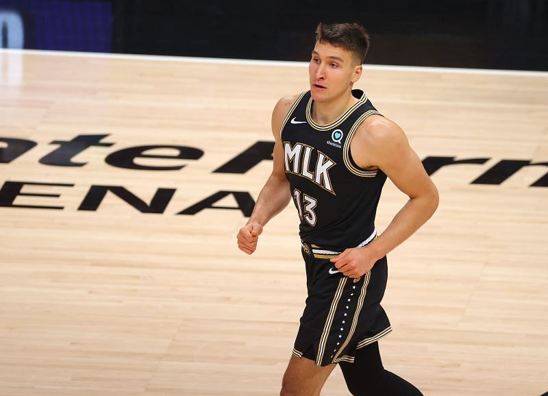 Bogdan Bogdanovic #13 of the Atlanta Hawks reacts after a basket against the Milwaukee Bucks during the first half in Game Six of the Eastern Conference Finals at State Farm Arena on July 03, 2021 in Atlanta, Georgia.