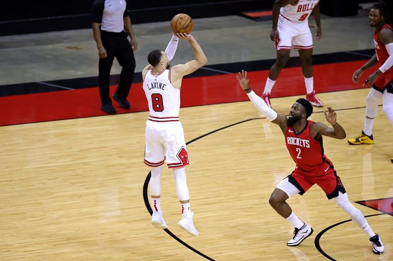Zach LaVine #8 of the Chicago Bulls shoots a basket ahead of David Nwaba #2 of the Houston Rockets