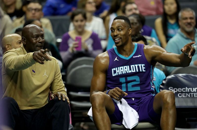 Michael Jordan, owner of the Charlotte Hornets, talks to Dwight Howard #12 of the Charlotte Hornets during their game against the Utah Jazz at Spectrum Center on January 12, 2018 in Charlotte, North Carolina.