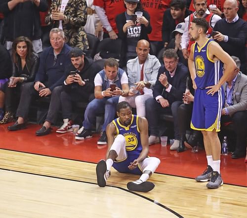 Kevin Durant #35 of the Golden State Warriors goes down with an apparent achilles injury during action against the Toronto Raptors in Game Five of the 2019 NBA Finals at Scotiabank Arena on June 10, 2019 in Toronto, Canada.