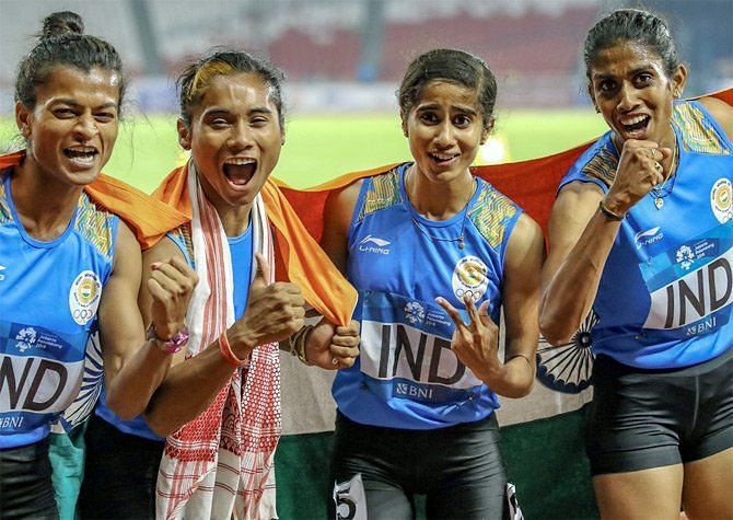 Saritaben Gaikwad, Hima Das, Vismaya Koroth and MR Poovamma after winning the women&#039;s 4x400m relay gold at the 2018 Asian Games. (Photo courtesy President of India / Twitter)