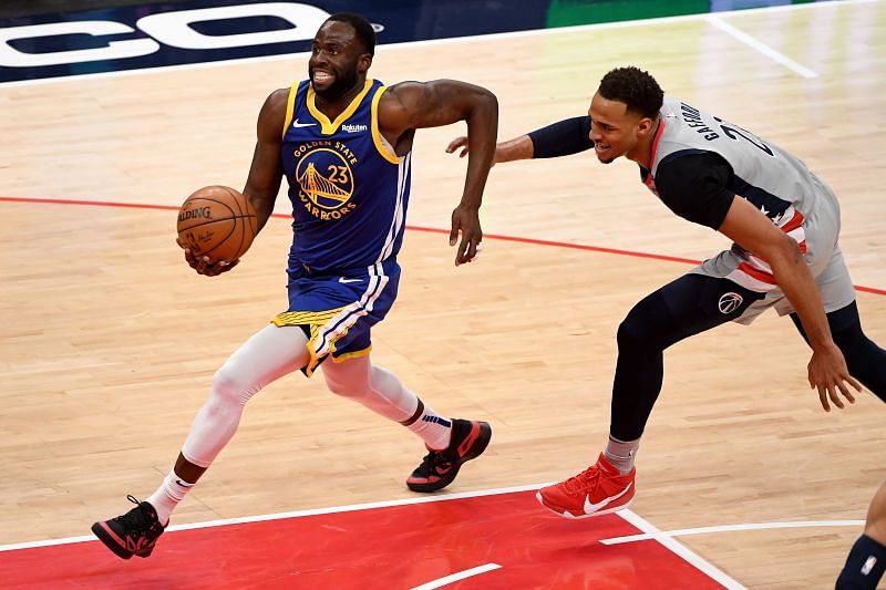 Draymond Green #23 of the Golden State Warriors drives against Daniel Gafford #21
