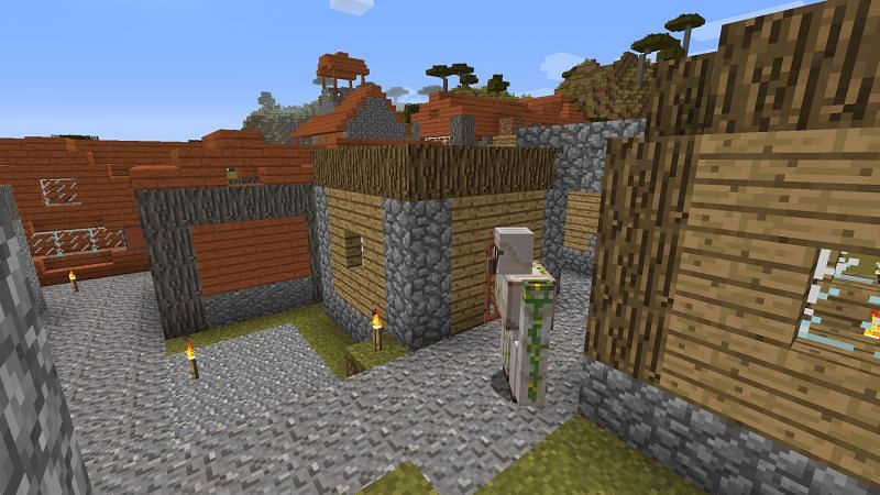 Iron golems can spawn naturally in villages, as well as by player control (Image via Minecraft)