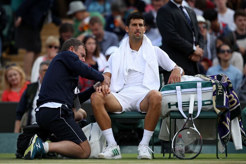 Novak Djokovic receiving treatment in his match against Tomas Berdych in Wimbledon 2017