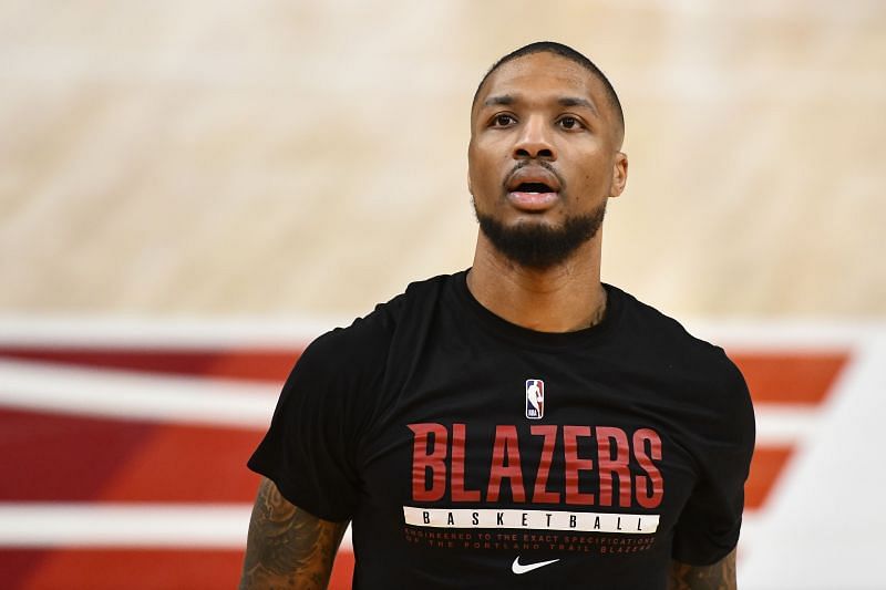 Damian Lillard #0 looks on before a game.