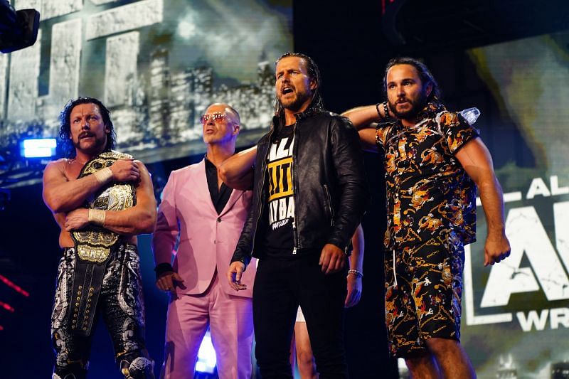 Adam Cole with The Elite Faction