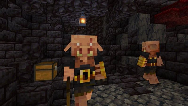 Two piglins guarding a chest in a bastion remnant (Image via Minecraft)