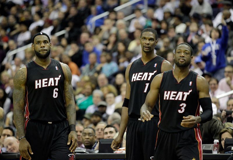 LeBron James #6 of the Miami Heat stands with teammates Chris Bosh, and Dwyane Wade in 2011.