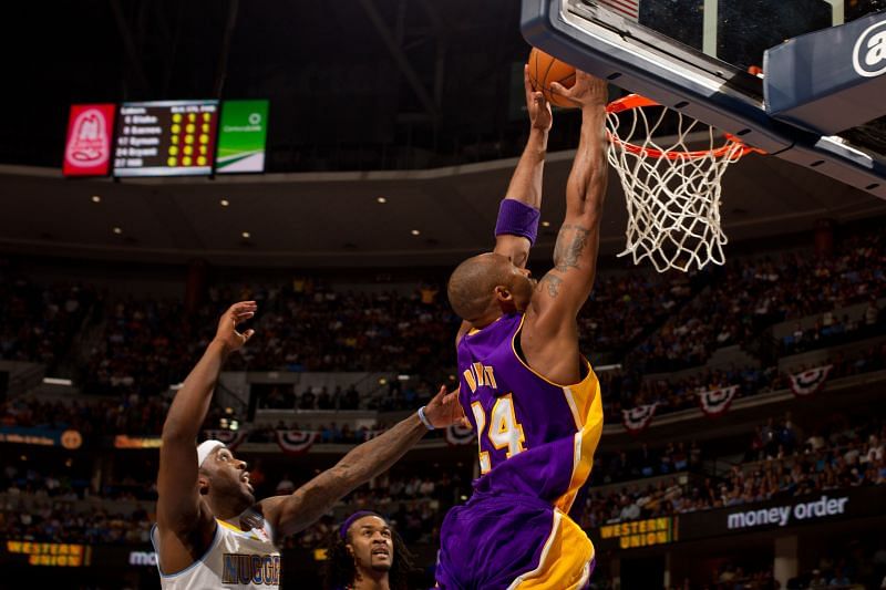 Kobe Bryant dunks the ball during an NBA game.